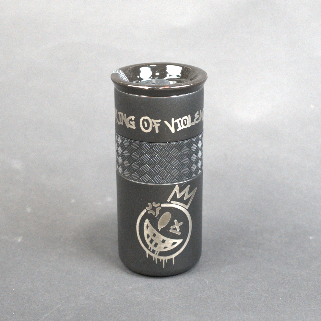 Black tumbler with a logo on a gray background
