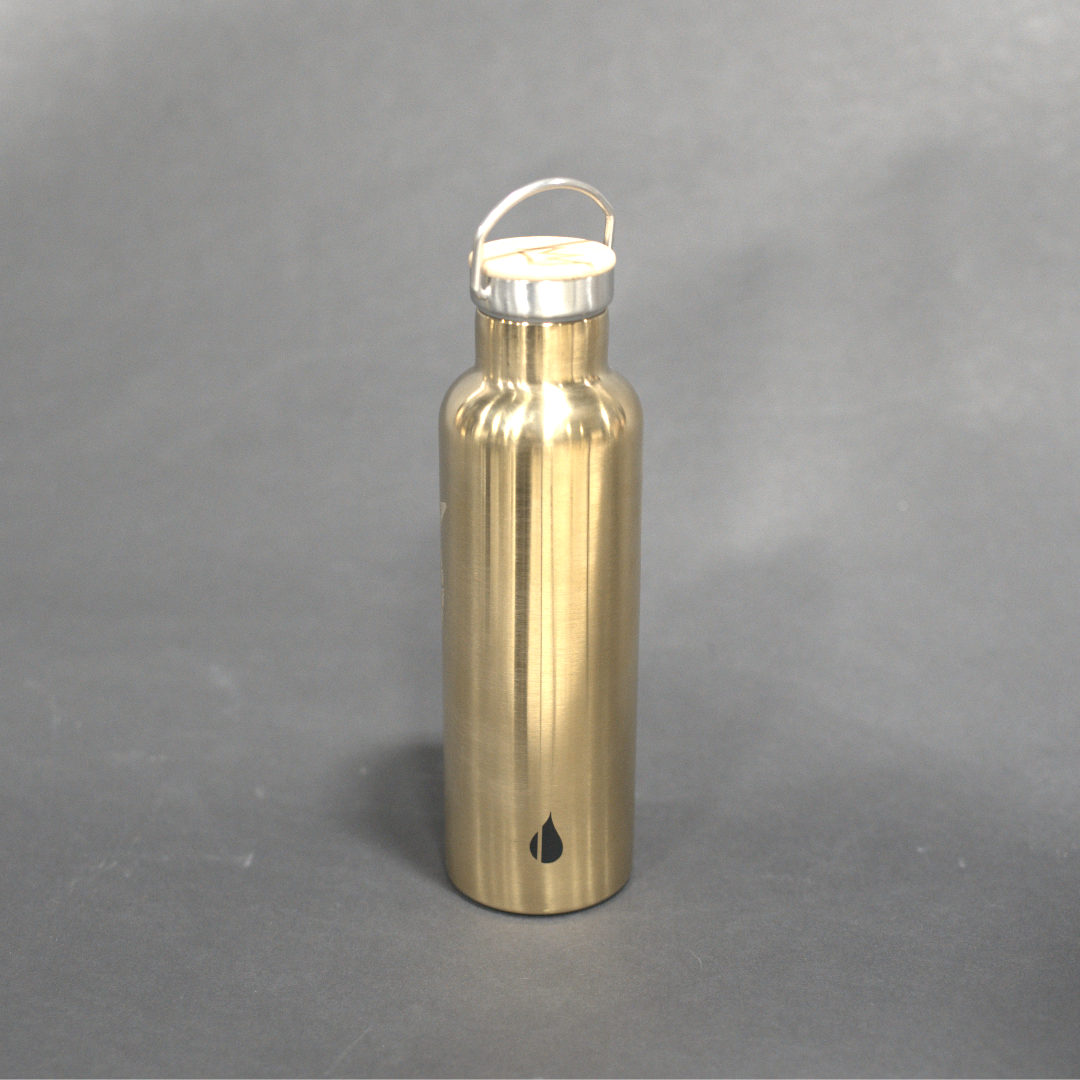 Gold water bottle with a white cap on a gray background