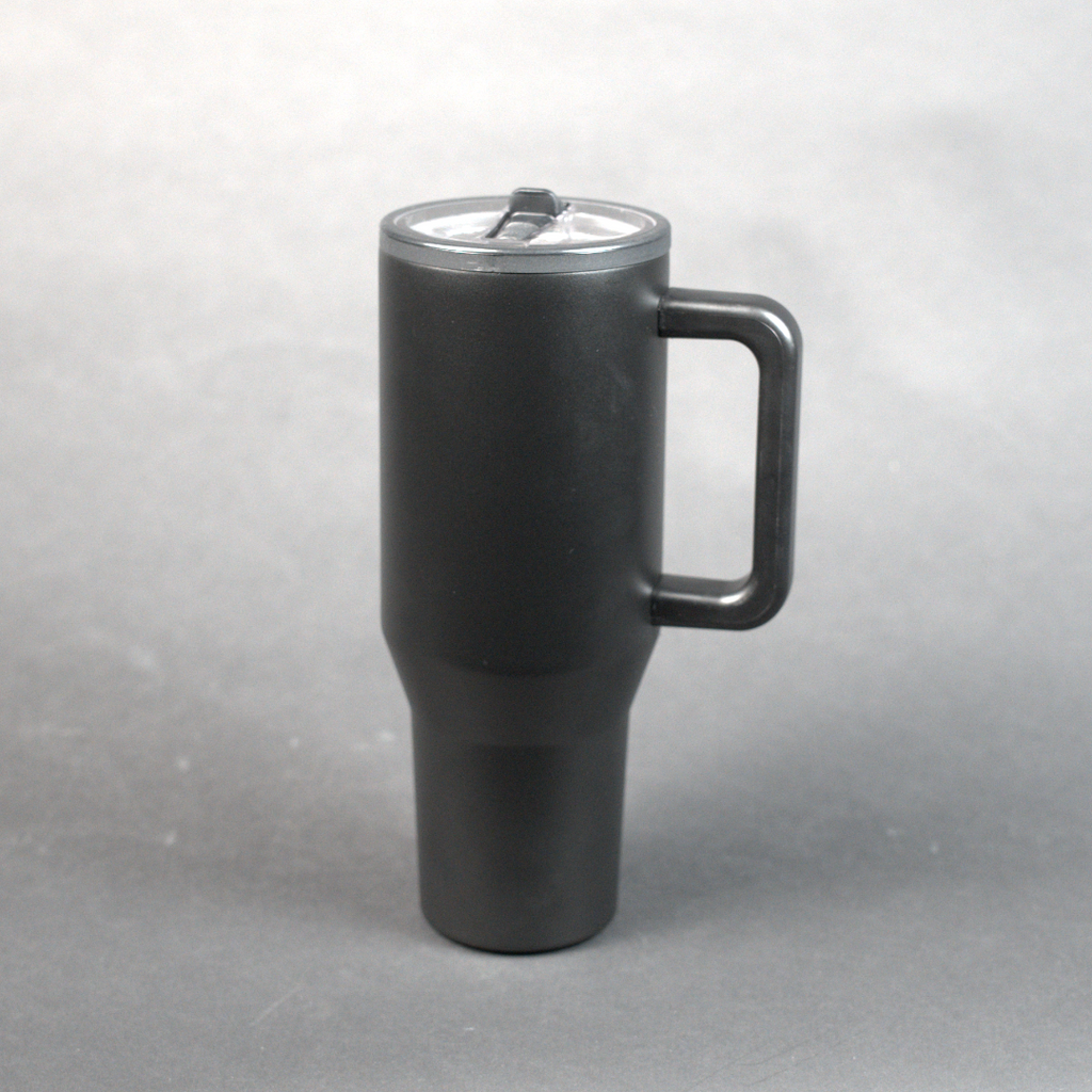 Black insulated mug with handle on a gray background